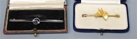 An early 20th century 15ct gold, sapphire and diamond bar brooch and a yellow metal horse head bar brooch.